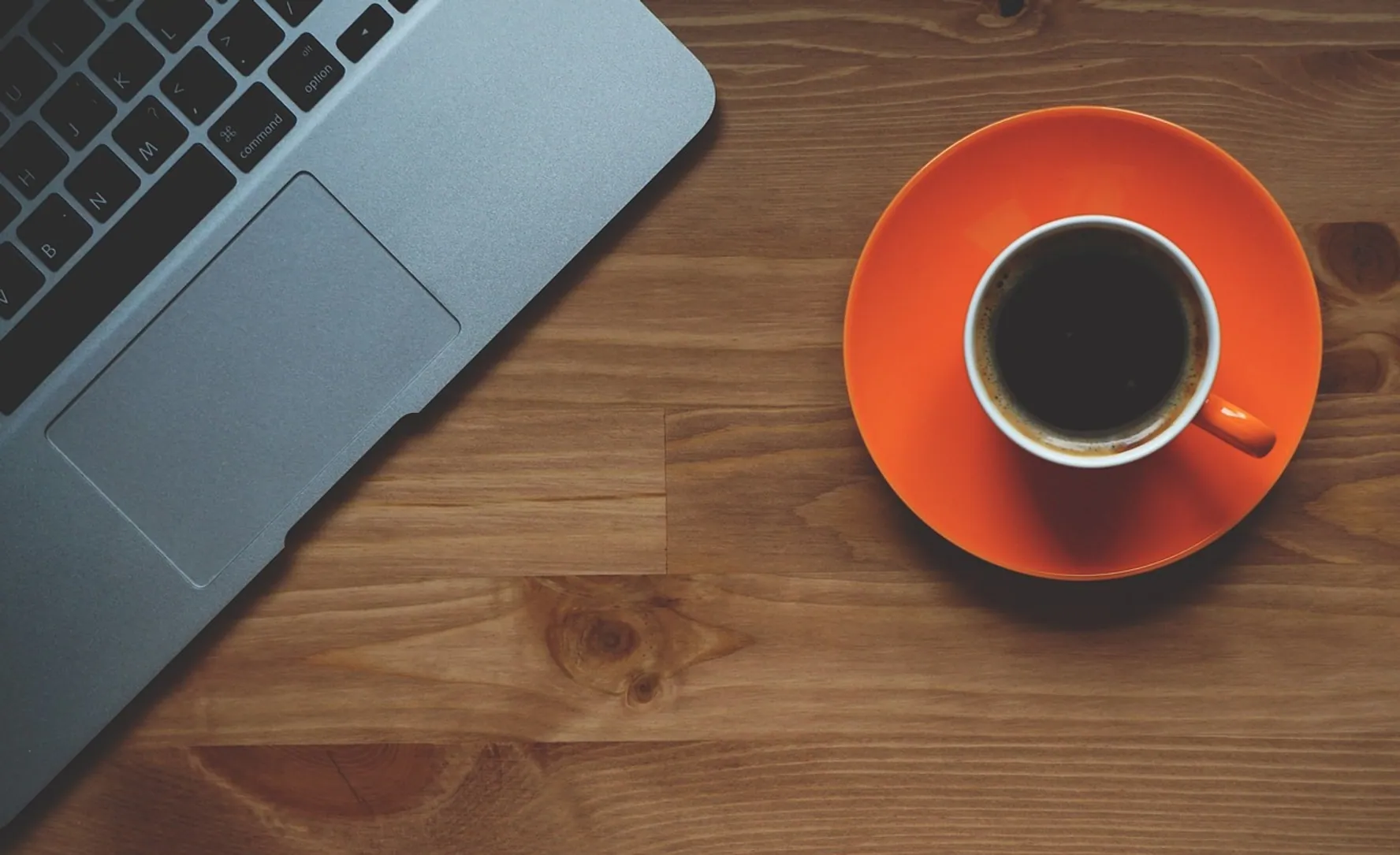 Cup of coffee, laptop and office